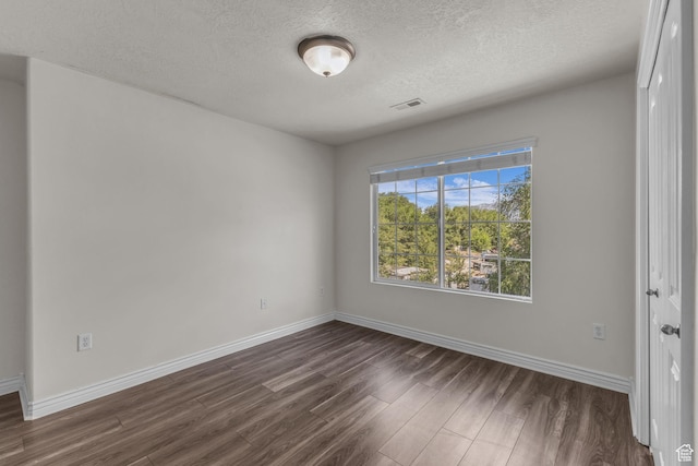 1195 W Dallin Dr Unit 304, Pleasant Grove, UT 84062 - spare room with dark wood-type flooring and a textured ceiling