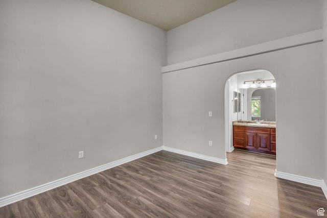 1195 W Dallin Dr Unit 304, Pleasant Grove, UT 84062 - unfurnished room with arched walkways and dark wood finished floors