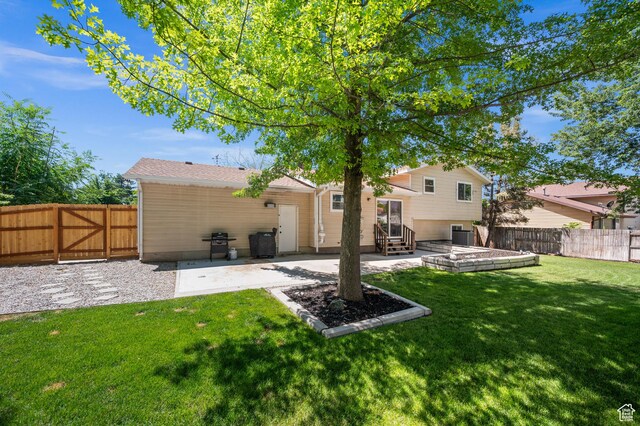 1609 E Sego Lily Dr, Sandy, UT 84092 - back of house featuring a patio