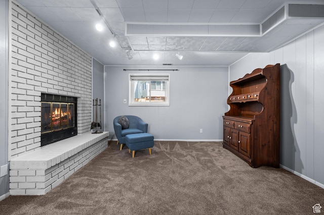 1609 E Sego Lily Dr, Sandy, UT 84092 - sitting room with carpet floors, track lighting, and a brick fireplace