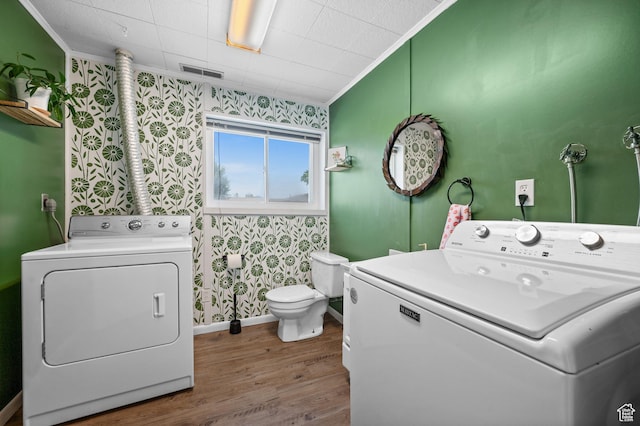 1609 E Sego Lily Dr, Sandy, UT 84092 - laundry room with wallpapered walls, ornamental molding, washer and clothes dryer, and wood finished floors