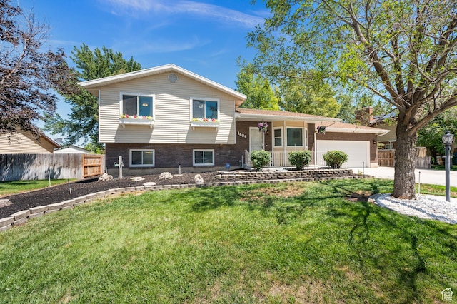 1609 E Sego Lily Dr, Sandy, UT 84092 - tri-level home with an attached garage, brick siding, and concrete driveway