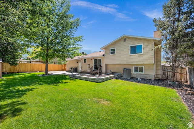 1609 E Sego Lily Dr, Sandy, UT 84092 - back of property featuring a fenced backyard, a chimney, and a patio area
