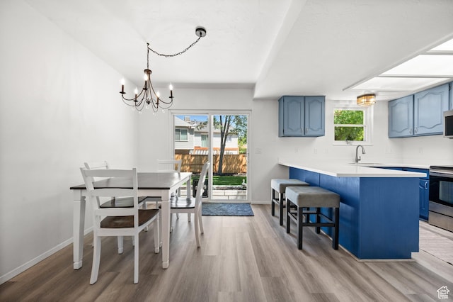 1609 E Sego Lily Dr, Sandy, UT 84092 - dining space with a chandelier and light wood finished floors