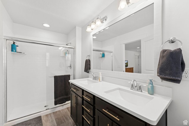 4915 N Marble Fox Way Unit 126, Lehi, UT 84043 - full bath featuring double vanity, a shower stall, wood finished floors, and recessed lighting