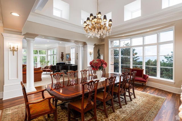 1781 Lorien Dr, Bountiful, UT 84010 - dining area featuring ornate columns, crown molding, dark wood finished floors, and a chandelier