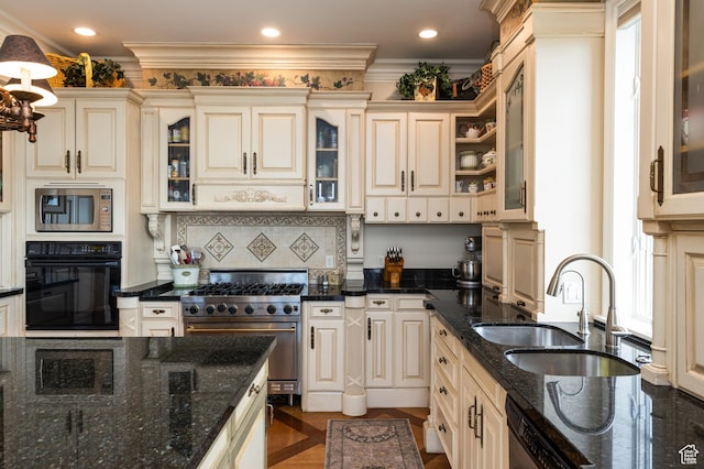 1781 Lorien Dr, Bountiful, UT 84010 - kitchen featuring appliances with stainless steel finishes, cream cabinetry, ornamental molding, dark stone countertops, and decorative backsplash
