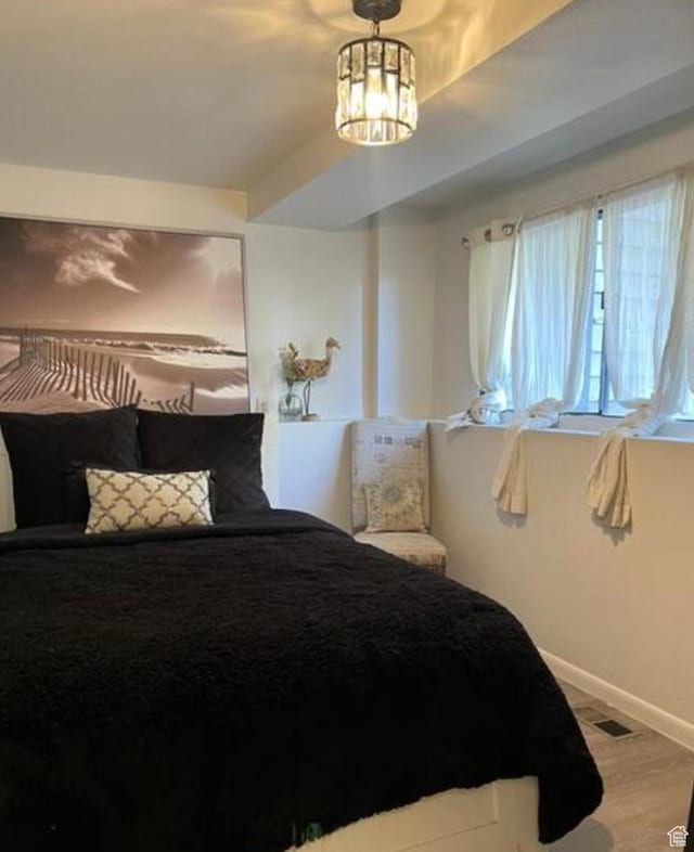 2267 W 4240 S, Taylorsville, UT 84129 - bedroom with a chandelier and baseboards