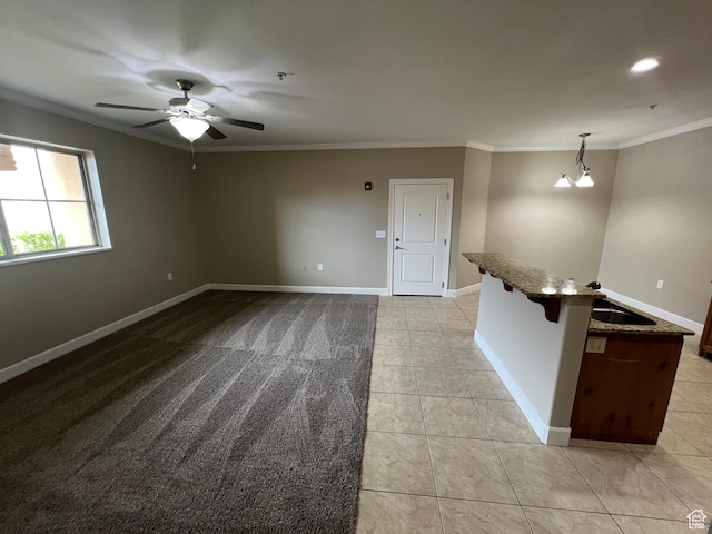 982 W 960 N Unit 101, Orem, UT 84057 - empty room featuring crown molding, light tile patterned flooring, and a ceiling fan