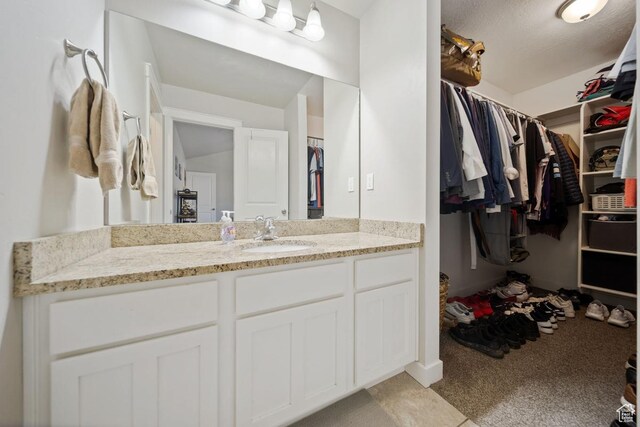 862 W Capraia Ct, Midvale, UT 84047 - bathroom featuring vanity and a walk in closet