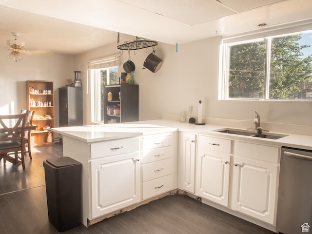 663 N 550 W, Orem, UT 84057 - kitchen with stainless steel dishwasher, dark wood-style flooring, a peninsula, and white cabinetry