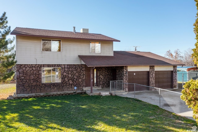 663 N 550 W, Orem, UT 84057 - view of front of house with stone siding, a garage, driveway, and a shingled roof