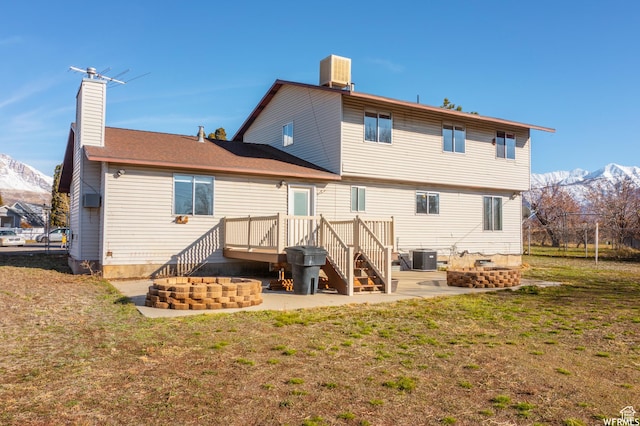 663 N 550 W, Orem, UT 84057 - back of property with a mountain view, a chimney, and a lawn