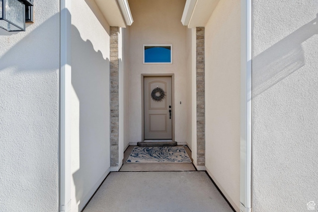 974 N Pleasant Valley Ln, Washington, UT 84780 - view of exterior entry featuring stone siding and stucco siding