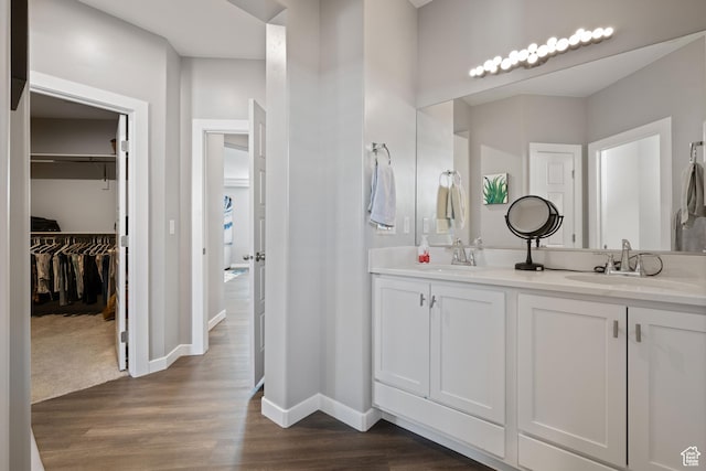 974 N Pleasant Valley Ln, Washington, UT 84780 - full bath featuring double vanity, wood finished floors, and a walk in closet