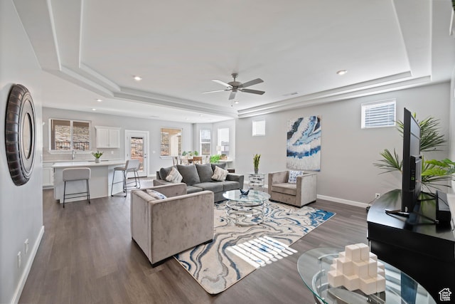 974 N Pleasant Valley Ln, Washington, UT 84780 - living area featuring a raised ceiling, dark wood-type flooring, a ceiling fan, plenty of natural light, and recessed lighting