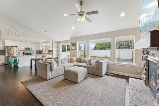 631 S Falkirk Rd, Heber City, UT 84032 - living room featuring vaulted ceiling, a stone fireplace, a chandelier, ceiling fan, and recessed lighting