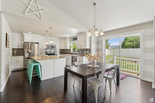 631 S Falkirk Rd, Heber City, UT 84032 - dining room with dark wood-type flooring, a chandelier, vaulted ceiling, and recessed lighting