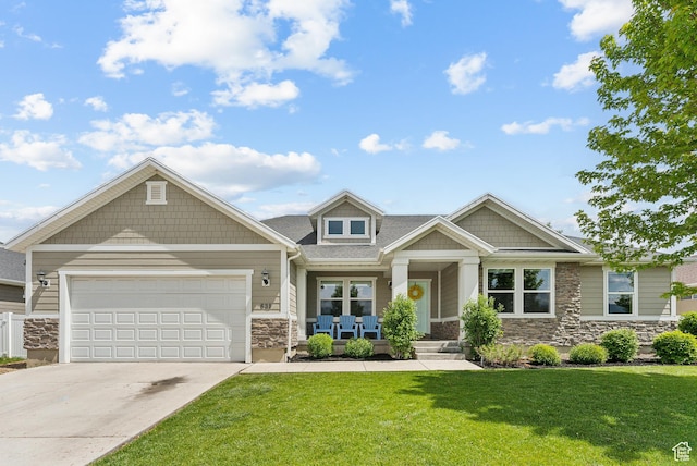 631 S Falkirk Rd, Heber City, UT 84032 - craftsman-style house featuring stone siding, concrete driveway, a front lawn, a garage, and covered porch