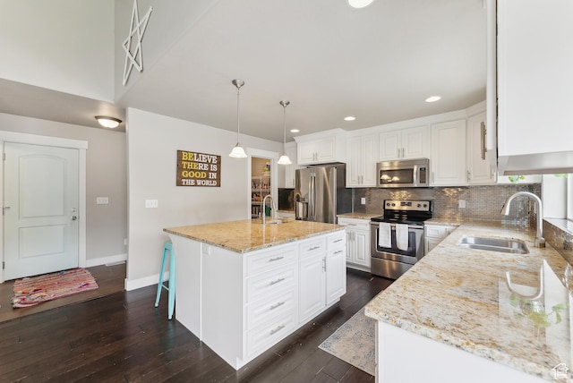 631 S Falkirk Rd, Heber City, UT 84032 - kitchen with appliances with stainless steel finishes, light stone counters, backsplash, white cabinets, and recessed lighting