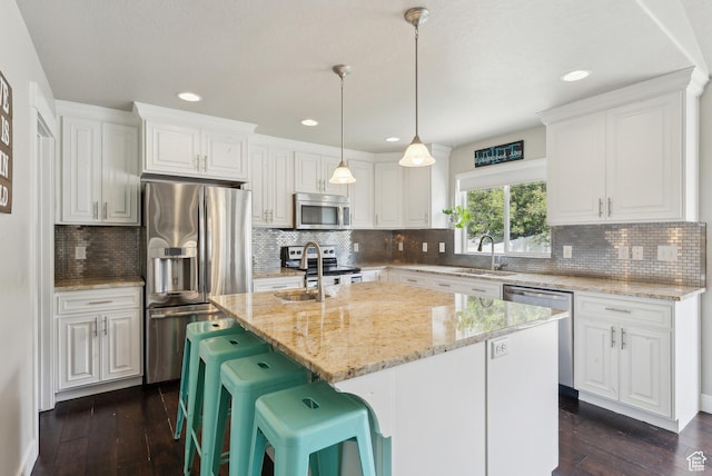 631 S Falkirk Rd, Heber City, UT 84032 - kitchen featuring stainless steel appliances, white cabinets, light stone counters, dark wood-style floors, and recessed lighting