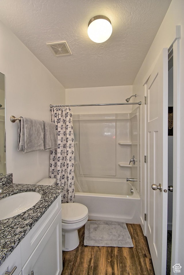 685 E 355 N, Vineyard, UT 84059 - full bathroom featuring wood finished floors, vanity, shower / tub combo with curtain, and a textured ceiling