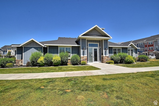 685 E 355 N, Vineyard, UT 84059 - view of front of home with stone siding, a front lawn, and board and batten siding