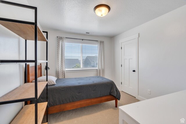 131 N Desert Sage Dr, Saratoga Springs, UT 84045 - carpeted bedroom featuring a textured ceiling