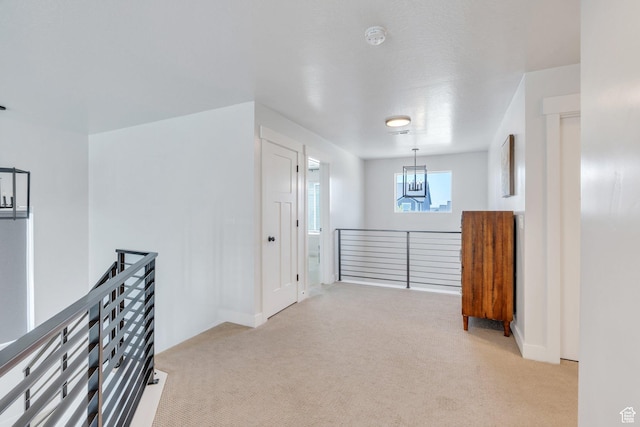 131 N Desert Sage Dr, Saratoga Springs, UT 84045 - hallway featuring an upstairs landing, carpet floors, and a chandelier
