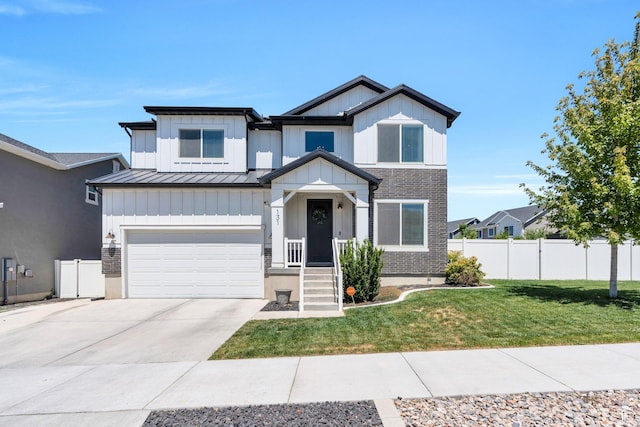131 N Desert Sage Dr, Saratoga Springs, UT 84045 - view of front facade featuring a garage, a standing seam roof, driveway, board and batten siding, and a metal roof
