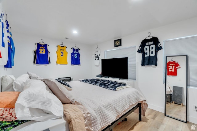 131 N Desert Sage Dr, Saratoga Springs, UT 84045 - bedroom with light wood-style floors and baseboards