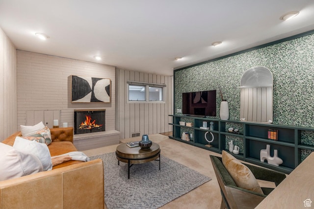 2722 E Eagle Way, Salt Lake City, UT 84108 - living area with wallpapered walls, carpet floors, and a brick fireplace