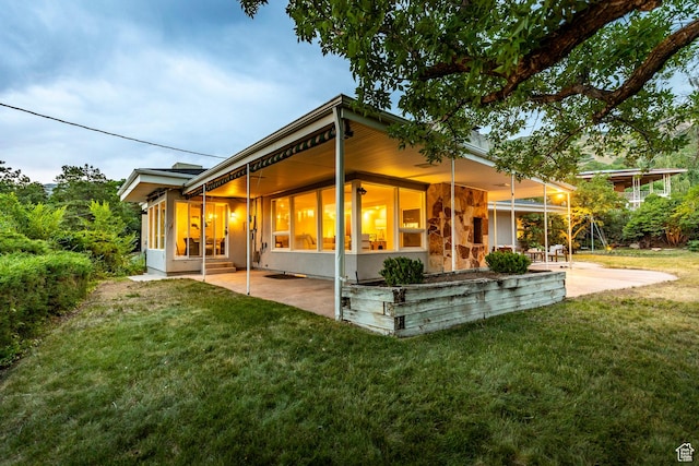 2722 E Eagle Way, Salt Lake City, UT 84108 - rear view of house featuring a lawn and a patio