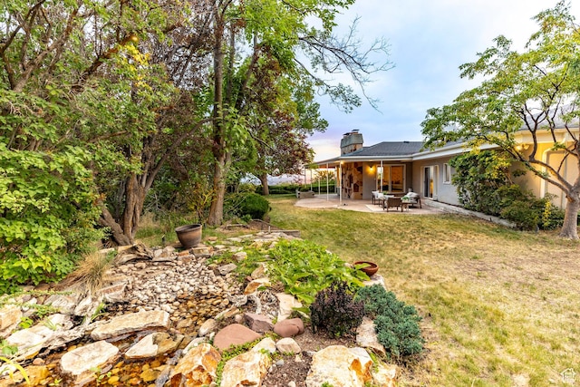 2722 E Eagle Way, Salt Lake City, UT 84108 - view of green lawn featuring a patio area