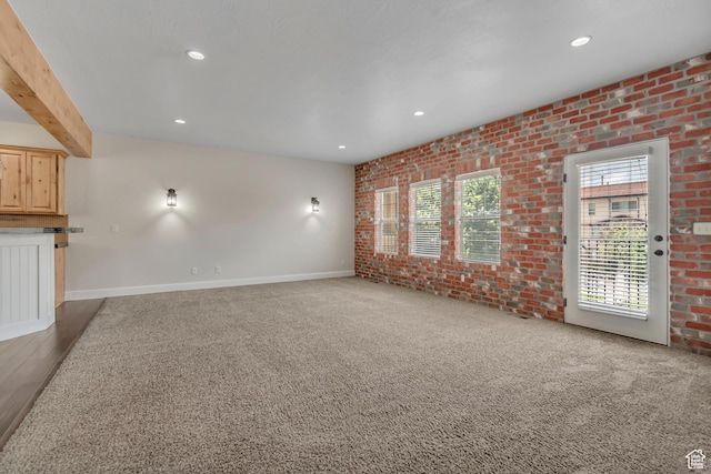 10925 N Marsala Dr, Highland, UT 84003 - unfurnished living room with brick wall, recessed lighting, and carpet floors