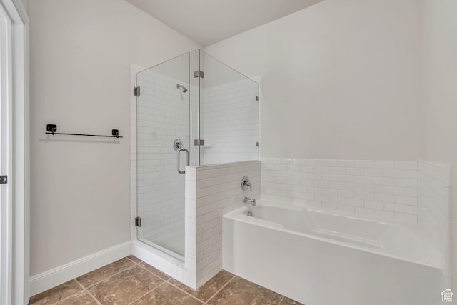 10925 N Marsala Dr, Highland, UT 84003 - bathroom featuring a garden tub, a stall shower, and tile patterned floors
