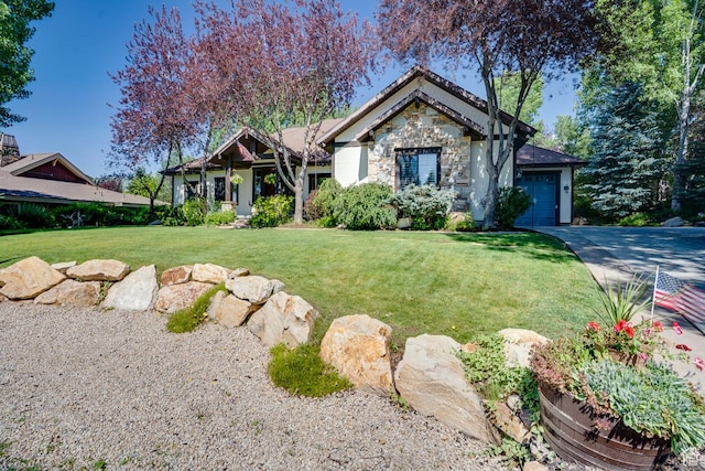 1307 N Dutch Highland Dr, Midway, UT 84049 - view of front of home with stone siding, an attached garage, a front yard, and driveway