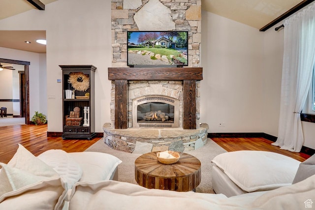 1307 N Dutch Highland Dr, Midway, UT 84049 - living room featuring vaulted ceiling, wood finished floors, and a stone fireplace