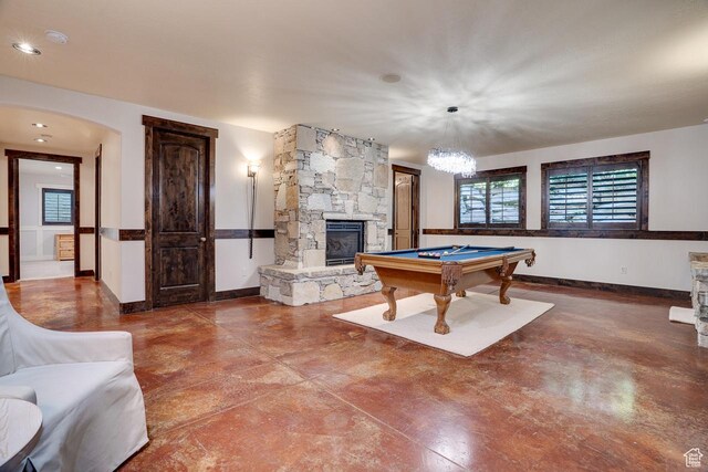 1307 N Dutch Highland Dr, Midway, UT 84049 - game room featuring billiards table, a stone fireplace, arched walkways, and concrete floors