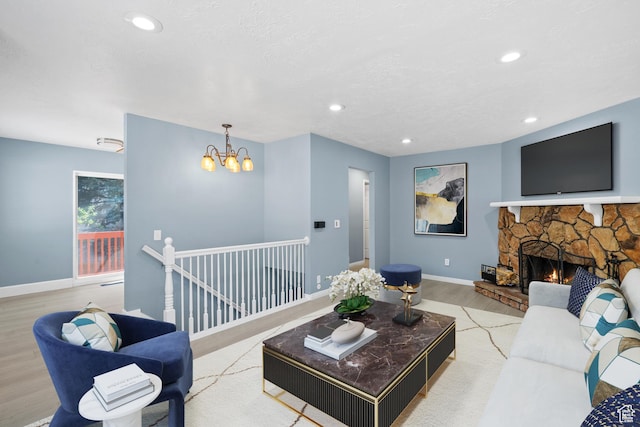 1410 S 50 W, Farmington, UT 84025 - living area featuring wood finished floors, a chandelier, a fireplace, and recessed lighting