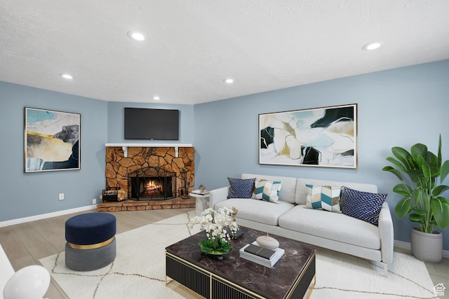 1410 S 50 W, Farmington, UT 84025 - living room featuring wood finished floors, recessed lighting, and a stone fireplace