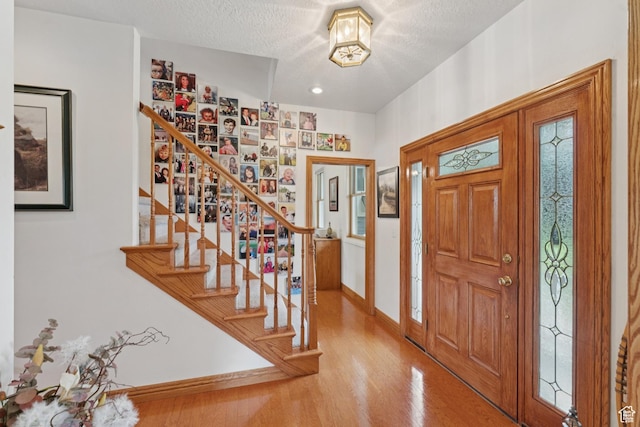 3136 W 2400th St S, Charleston, UT 84032 - entryway featuring stairway, wood finished floors, and a textured ceiling