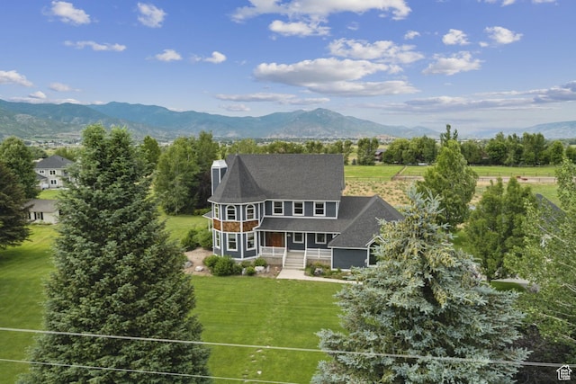 3136 W 2400th St S, Charleston, UT 84032 - back of property featuring a porch, a lawn, a mountain view, and a chimney