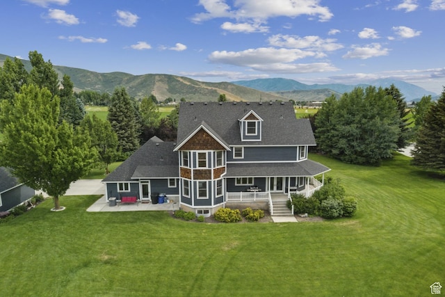 3136 W 2400th St S, Charleston, UT 84032 - back of house with a mountain view, a yard, a porch, and a patio area