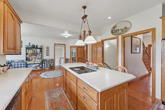 3136 W 2400th St S, Charleston, UT 84032 - kitchen featuring dishwasher, light wood finished floors, a center island, black electric stovetop, and hanging light fixtures