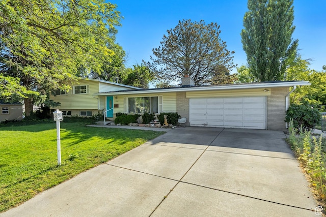1261 E Sandra Cir, Murray, UT 84121 - tri-level home featuring concrete driveway, a garage, brick siding, and a front lawn
