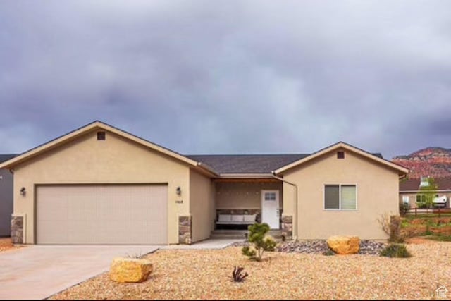1468 S Sage Ct S Unit 13, Kanab, UT 84741 - ranch-style home with a garage, stucco siding, and driveway
