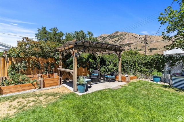158 N 800 E, Brigham City, UT 84302 - fenced backyard with a vegetable garden, a mountain view, a patio, an outdoor living space, and a pergola