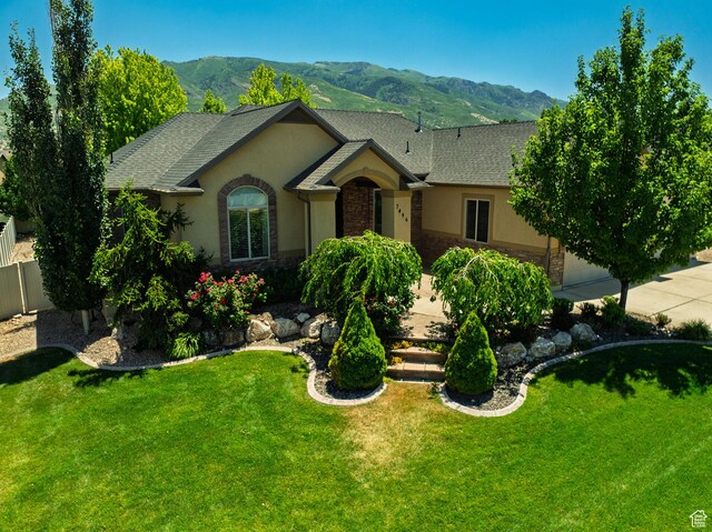 7496 S 1740 E, South Weber, UT 84405 - view of front of house with stucco siding, a mountain view, stone siding, and roof with shingles