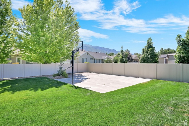 7496 S 1740 E, South Weber, UT 84405 - fenced backyard with a mountain view and basketball hoop